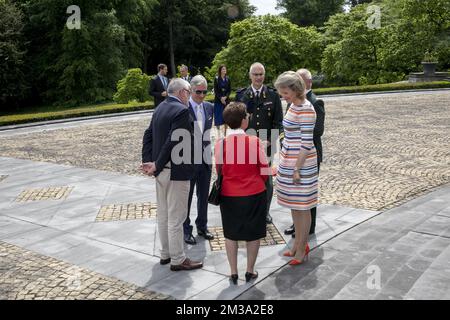 King Philippe - Filip of Belgium (2L) and Queen Mathilde of Belgium (R) pictured during a royal reception for Paralympic athletes and participants of the Invictus Games, at the Royal Castle in Laken - Laeken on Friday 13 May 2022. BELGA PHOTO HATIM KAGHAT
