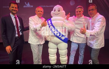 Michelin international director Gwendal Poullennec, Chef Peter Goossens of Hof Van Cleve, the Michelin mascotte, Chef Tim Boury of 'Boury' and Chef Viki Geunes of 'Zilte' pictured during the presentation of the new edition of the Michelin 2022 restaurant and hotel guide for Belgium and Luxembourg, in Mons, Monday 23 May 2022. BELGA PHOTO VIRGINIE LEFOUR Stock Photo