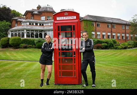 Belgium's goalkeeper Diede Lemey and Belgium's goalkeeper Nicky Evrard posing for the photographer next to an English telephone boot ahead of a press conference of the Belgium's national women's soccer team the Red Flames, Friday 08 July 2022 in Wigan, England, in preparation of the Women's Euro 2022 tournament. The 2022 UEFA European Women's Football Championship is taking place from 6 to 31 July. BELGA PHOTO DAVID CATRY Stock Photo