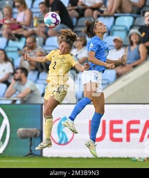 Belgium's Davina Philtjens and Italy's Agnese Bonfantini fight for the ball during a game between Belgium's national women's soccer team the Red Flames and Italy, in Manchester, England on Monday 18 July 2022, third and final game in the group D at the Women's Euro 2022 tournament. The 2022 UEFA European Women's Football Championship is taking place from 6 to 31 July. BELGA PHOTO DAVID CATRY Stock Photo