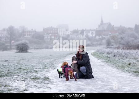 Chester, UK. 12th Dec, 2022. A dog walker hugs her dog on a frosty winter's day in Chester, UK. Credit: Simon Hyde/Alamy Live News. Stock Photo