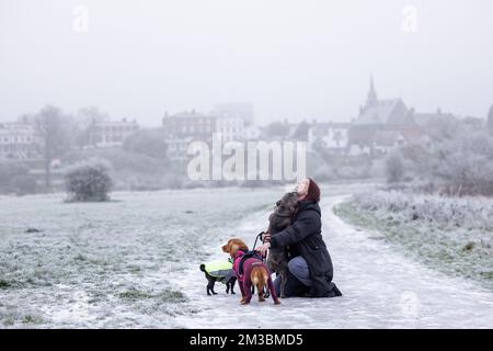 Chester, UK. 12th Dec, 2022. A dog walker hugs her dog on a frosty winter's day in Chester, UK. Credit: Simon Hyde/Alamy Live News. Stock Photo