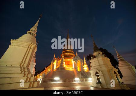 Twilight Scenes of Pagoda at Wat Suan Dok temple.The large 48 meter high bell shaped Chedi,built in a Sri Lankan style in Chiang Mai,Northern Thailand. Stock Photo