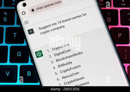 OPEN AI ChatGPT chat bot seen on smartphone placed on laptop. AI chatbot responded to the question about crypto company names ideas. Stafford, United Stock Photo
