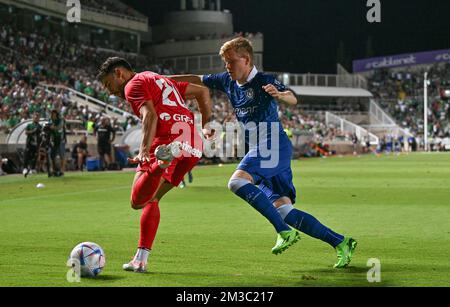 Omonia's Panagiotis Zachariou and Gent's Jens Petter pictured in action during a soccer game between Cypriot Omonia Nicosia and Belgian KAA Gent in Nicosia, Cyprus on Thursday 25 August 2022, the return leg of the play-offs for the UEFA Europa League competition. BELGA PHOTO DAVID CATRY Stock Photo