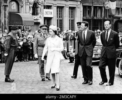 19660510 - ANTWERP, BELGIUM (FILE) : This file picture dated 10 May 1966 is about United Kingdom sovereigns visit to Belgium. On this picture : Queen Elizabeth II of United Kingdom, King Baudouin of Belgium and Prince Philip, Duke of Edinburgh in their way for Antwerp city hall. BELGA PHOTO ARCHIVES Stock Photo