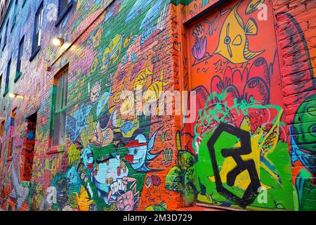 Abstract colourful graffiti paintings on concrete walls.  Street art, background, texture. Stock Photo