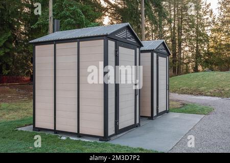 Modern public toilet exterior outdoor. Modern Toilet building, outdoor, summer time in a park. Front view of modern restroom. Facade of outdoor lavato Stock Photo