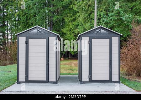 Modern public toilet exterior outdoor. Modern Toilet building, outdoor, summer time in a park. Front view of modern restroom. Facade of outdoor lavato Stock Photo