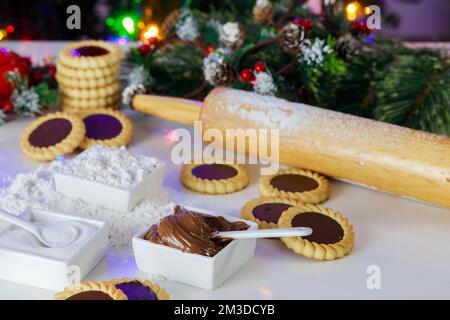 Christmas linzer cookie with hazelnut spread inside. Stock Photo