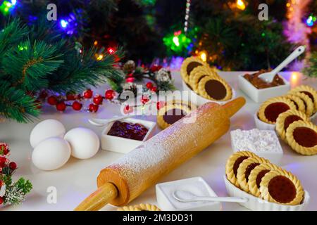 Ingredients for making Christmas linzer cookies on table. Stock Photo
