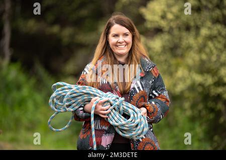 woman worker working with rope and cord on a ute in australia Stock Photo