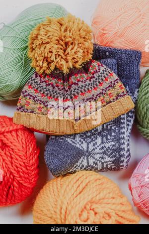 Knitting. Knitting warm clothes on your own. Tangles of wool and knitted things Stock Photo