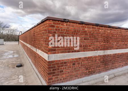 Old industrial, commercial brick building at roof. Stock Photo
