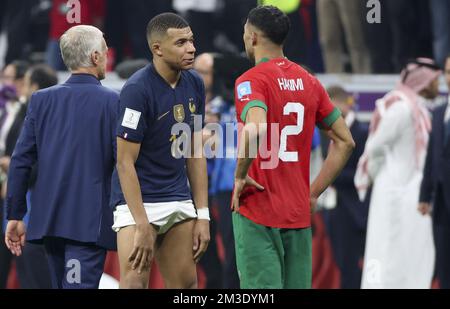 Kylian Mbappe of France exchanges his jersey with Achraf Hakimi of Morocco  following the FIFA World Cup 2022, Semi-final football match between France  and Morocco on December 14, 2022 at Al Bayt