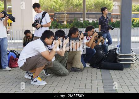 HONG KONG - OCT 06: photographers taking photos on October 06, 2013 in Hong Kong. A lot of professional Hong Kong photographers operates a full servic Stock Photo