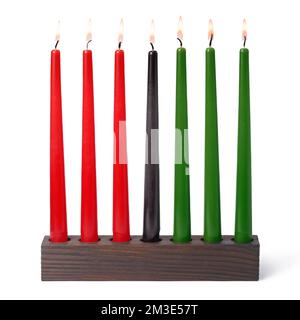 Kwanzaa festival concept with seven candles red, black and green in candlestick is isolated on white background Stock Photo