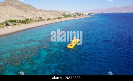 Coral 2000 boat in Coral Beach Nature Reserve . Tourist Yellow boat in Eilat, Israel. Stock Photo