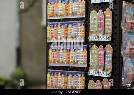 Poland travel destination, polish flag, magnets from Gdansk, world map, travel concept, EU. Souvenir street market shop. Stock Photo