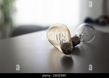 Power energy saving concept. light bulb with light on on gray background. Stock Photo