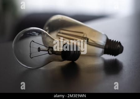 Power energy saving concept. light bulb with light on on gray background. Stock Photo