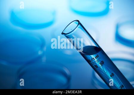 science lab with clear blue background and test tubes with blue chemicals Stock Photo