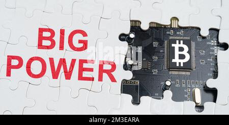 Business and technology concept. On the puzzles there is a processor with a bitcoin symbol and it says - big power Stock Photo