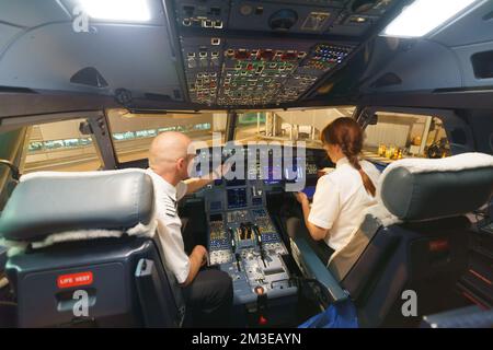 HELSINKI - SEPTEMBER 20: Finnair pilots preparing aircraft for take-off from the airport on September 20, 2014 in Helsinki, Finland. Finnair is the fl Stock Photo