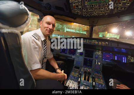 HELSINKI - SEPTEMBER 20: Finnair pilots preparing aircraft for take-off from the airport on September 20, 2014 in Helsinki, Finland. Finnair is the fl Stock Photo