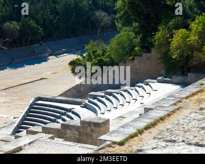 Odeon a classic greek open-air theatre. Old theater with marble seats and stairs. The Acropolis of Rhodes. Monte Smith Hill, Rhodes island, Greece Stock Photo