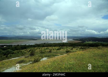 View across the River Kent Estuary at low tide with the Kent Viaduct and the Lake District in the distance from Arnside Knott, Arnside, Cumbria, Engla Stock Photo