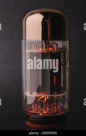 Electronic vacuum tube 6P3S-E on grey background Stock Photo