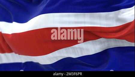 Close-up view of the Costa Rica national civil flag waving in the wind. The Republic of Costa Rica is a State of Central America. Fabric textured back Stock Photo