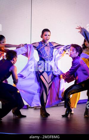 Bangkok, Thailand. 14th Dec, 2022. SILVY Pavida has her wardrobe changed by backup dancers during a live performance. The Standard, Bangkok Mahanakhon, celebrates its grand opening with a Festival of Music on 14 December 2022, officially marking the celebrated arrival of The Standard's Asia flagship in the Thai capital. Credit: Matt Hunt/Neato/Alamy Live News Stock Photo