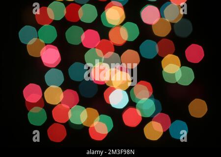 Defocused colorful lights on black background Stock Photo