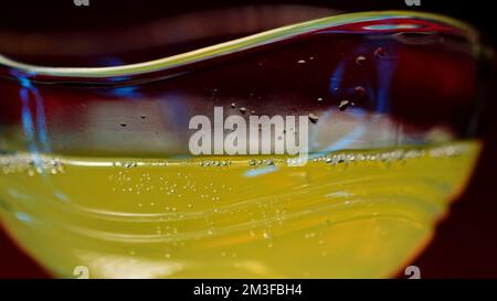 Refreshing colorful drink in a transparent glass. Stock clip. Prepared juciy cocktail at the night club party Stock Photo