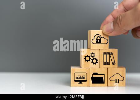 wooden cube for document management digital file data online cybersecurity Protection and data security concept. Stock Photo