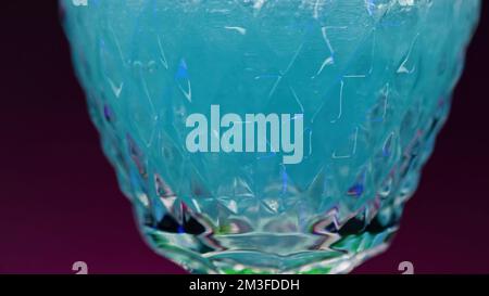Refreshing colorful drink in a transparent glass. Stock clip. Prepared juciy cocktail at the night club party Stock Photo