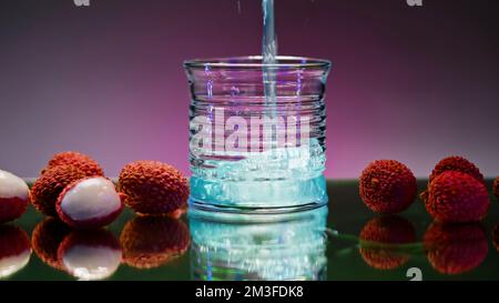 Refreshing colorful drink in a transparent glass. Stock clip. Prepared juciy cocktail at the night club party Stock Photo