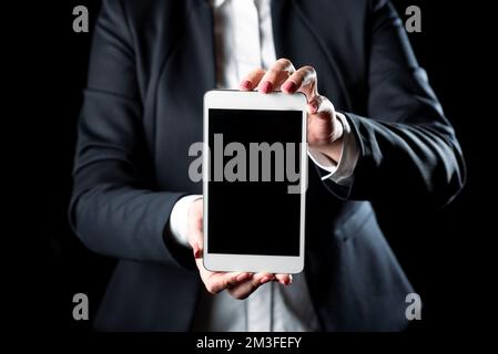 Businesswoman Holding Tablet And Presenting Information On It. Woman Showing On Screen. Executive Displaying Late Achievements On Cellphone. Stock Photo