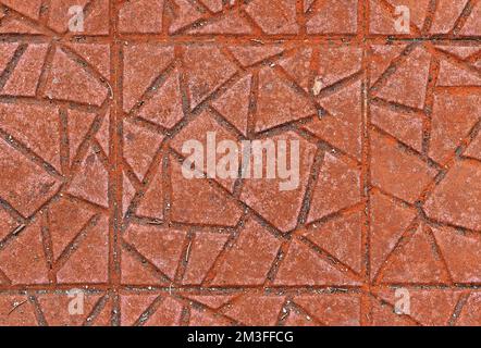 Red textured concrete blocks on floor Stock Photo