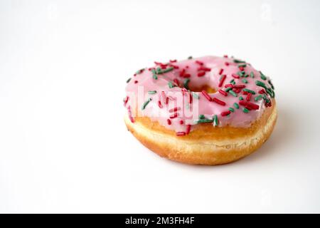 Pink Strawberry sprinkle donuts isolated on white background Stock Photo