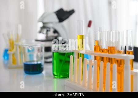 Chemistry test tubes on the table with colorful liquids Stock Photo