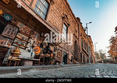 Ankara-Turkey, December 09, 2022: Detail of a souvenir shop and the street near Ankara Castle in Ankara, Turkey. Copper lanterns, tray, iron, pitcher, Stock Photo