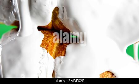 Concept of delicious breakfast. Stock clip. White glaze draining down the freshly baked croissants, close up view Stock Photo