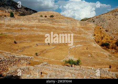 a view over the ruins of the acropolis of Mycenae, in Argolis, Greece, on top of a hill, on a summer day Stock Photo