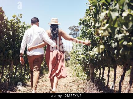 Doing something different for our second date. a young couple out on a date at a vineyard. Stock Photo