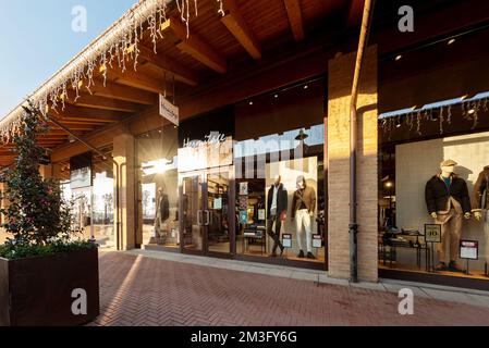 Mondovì, Cuneo, Italy - December 07, 2022: Hermitage Uomo clothing and sportswear for men store in Mondovicino outlet village, Hermitage Uomo is a bra Stock Photo