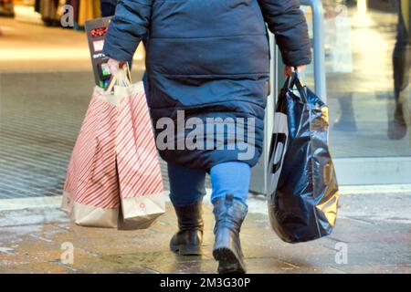 Glasgow, Scotland, UK 15th December, 2022. Christmas Shopping on the style mile of Scotland, Buchanan street. Saw shoppers enter into the festive spirit of buying stuff as the streets and shops were packed in the sunshine. Credit Gerard Ferry/Alamy Live News Stock Photo