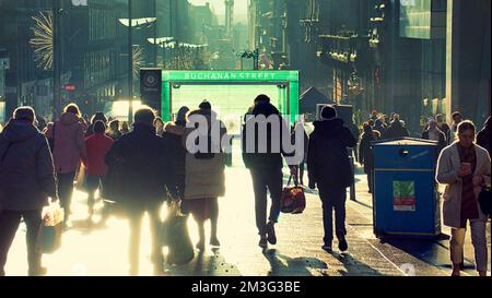 Glasgow, Scotland, UK 15th December, 2022. Christmas Shopping on the style mile of Scotland, Buchanan street. Saw shoppers enter into the festive spirit of buying stuff as the streets and shops were packed in the sunshine. Credit Gerard Ferry/Alamy Live News Stock Photo